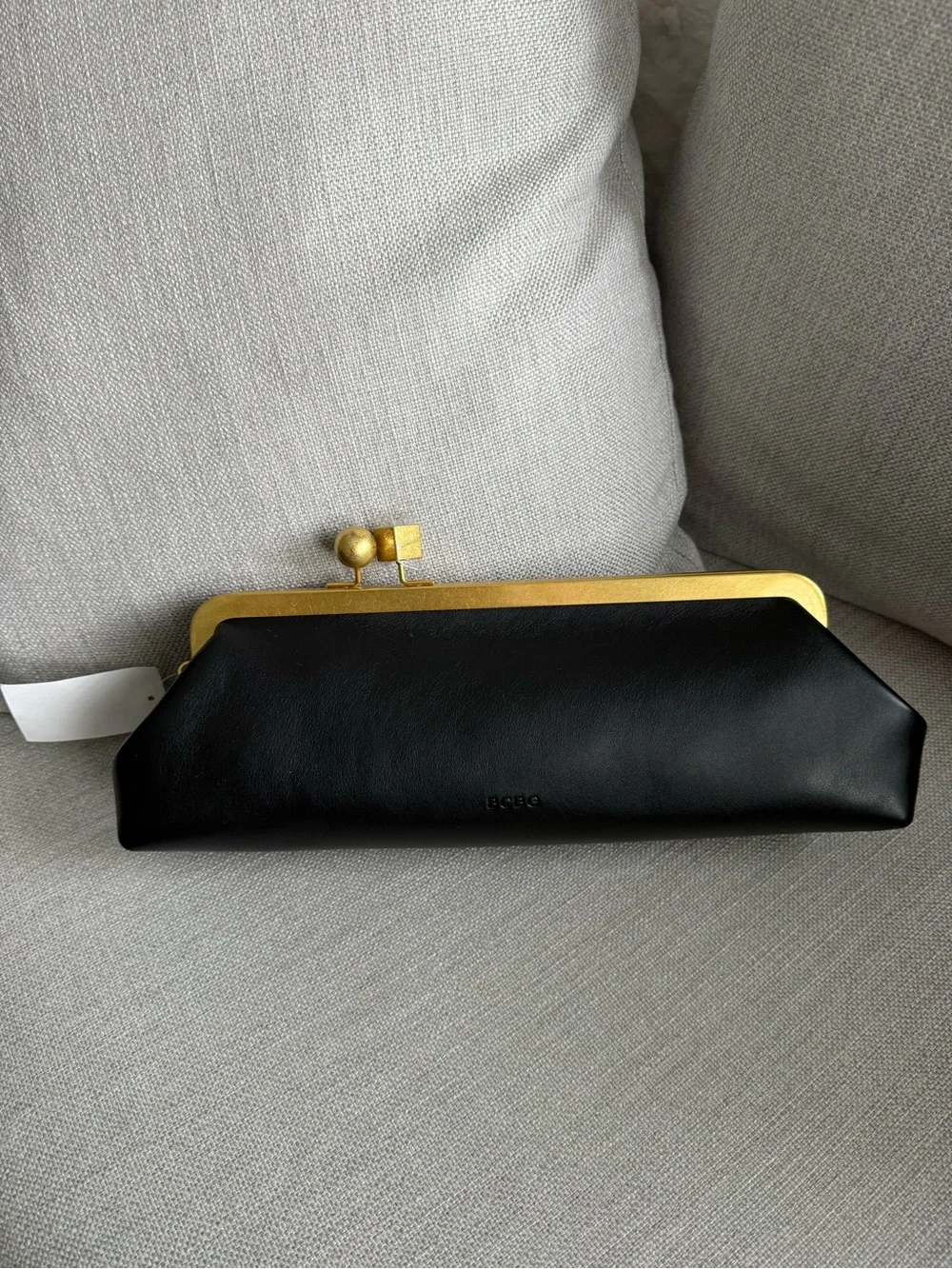 BCBG East West frame shoulder bag NWt black An asymmetric kiss-lock closure add